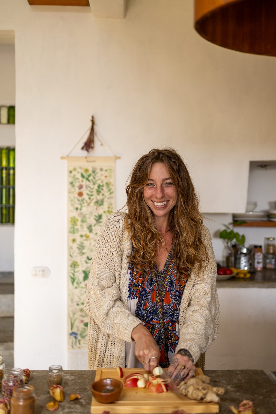 Chrystee preparing herbs in a kitchen