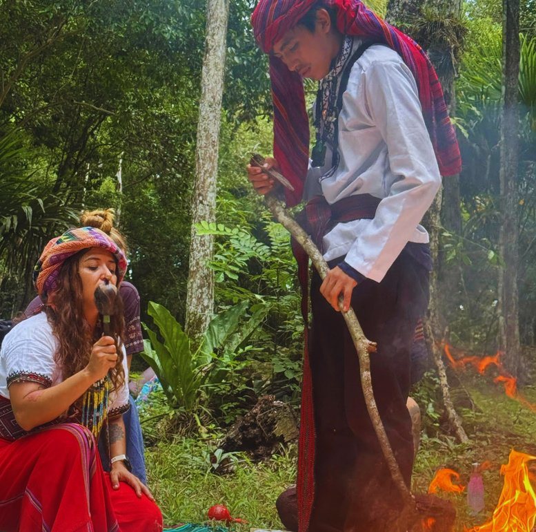 A Mayan fire ceremony beside the pyramids at Tikal